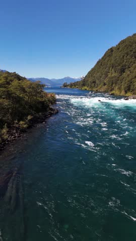 Vertical Drone View Flying Upstream Petrohue River Toward Scenic Mountain Horizon