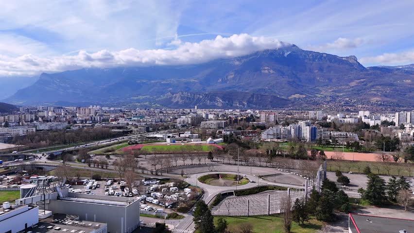 Aerial drone flyover of Grenoble industrial area and transport infrastructure