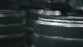 Metallic clamp firmly gripping brewery keg, securing beverage during storage and transportation within industrial production environment - Powered by Shutterstock - Get 15% off with code: PIKWIZARD15