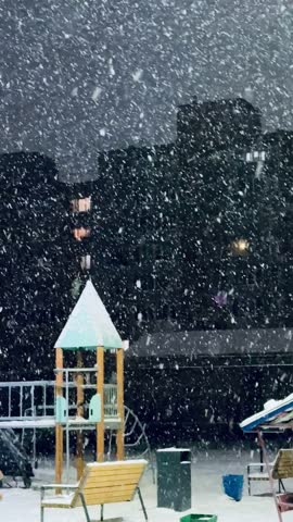 Snow Covered Playground During Heavy Snowfall, Empty Colorful Slides And Swings Dusted In Fresh Powder, Wooden Climbing Tower And Metal Railings Rimed With Frost, Benches Layered With Snow.