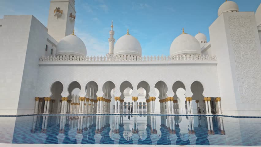 Sheikh Zayed Grand Mosque in Abu Dhabi, featuring majestic white marble architecture, large domes, minarets, and reflective pools. Iconic Islamic landmark and symbol of culture, spirituality, and architectural beauty in the United Arab Emirates.