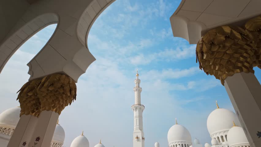 Sheikh Zayed Grand Mosque in Abu Dhabi, featuring majestic white marble architecture, large domes, minarets, and reflective pools. Iconic Islamic landmark and symbol of culture, spirituality, and architectural beauty in the United Arab Emirates.