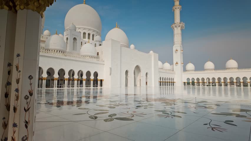 Sheikh Zayed Grand Mosque in Abu Dhabi, featuring majestic white marble architecture, large domes, minarets, and reflective pools. Iconic Islamic landmark and symbol of culture, spirituality, and architectural beauty in the United Arab Emirates.