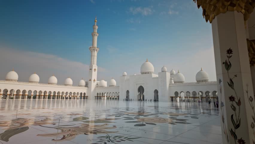 Sheikh Zayed Grand Mosque in Abu Dhabi, featuring majestic white marble architecture, large domes, minarets, and reflective pools. Iconic Islamic landmark and symbol of culture, spirituality, and architectural beauty in the United Arab Emirates.