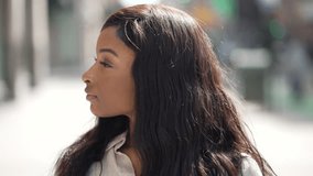 Young African American woman in city - Powered by Shutterstock - Get 15% off with code: PIKWIZARD15