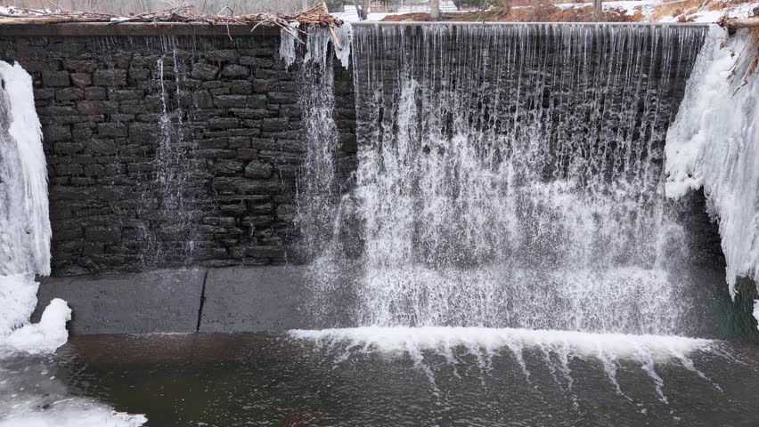 Winter aerial view featuring the Bell Pond dam in Wethersfield, Connecticut