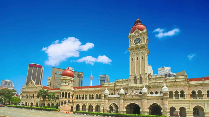 KUALA LUMPUR, MALAYSIA - Mei 29, 2022:

The Sultan Abdul Samad Building is a late-nineteenth century building located along Jalan Raja in front of the Dataran Merdeka and the Royal Selangor Club.National Textile Museum located at Kuala Lumpur in. Translation: "National Textile Museum"Sultan Abdul Samad Building in Kuala Lumpur, Merdeka Square in downtown MalaysiaKuala Lumpur ,   Malaysia A landscape of the historical Sultan Abdul Samad building on a cloudy dayskyscraper, brick, destination, metropolis, court, islamic,  , buildings, blue, islam, central, government, freedom, famous, malaysian, culture, arch, landscape, capital, travel, sultan, urban, asia, kl, architecture, malaysia, tourism, exterior, city, samad, abdul, square, history, clock, heritage, merdeka, tower, landmark, cityscape, colonial,historical, asian, historic, street, dome, kuala downtown, independence