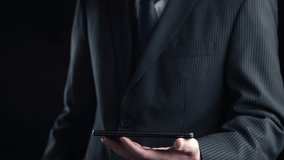 A businessman holds a smartphone displaying digital cloud technology icons, illustrating concepts of data transfer, security, and innovative storage solutions in a modern setting. Qubit - Powered by Shutterstock - Get 15% off with code: PIKWIZARD15