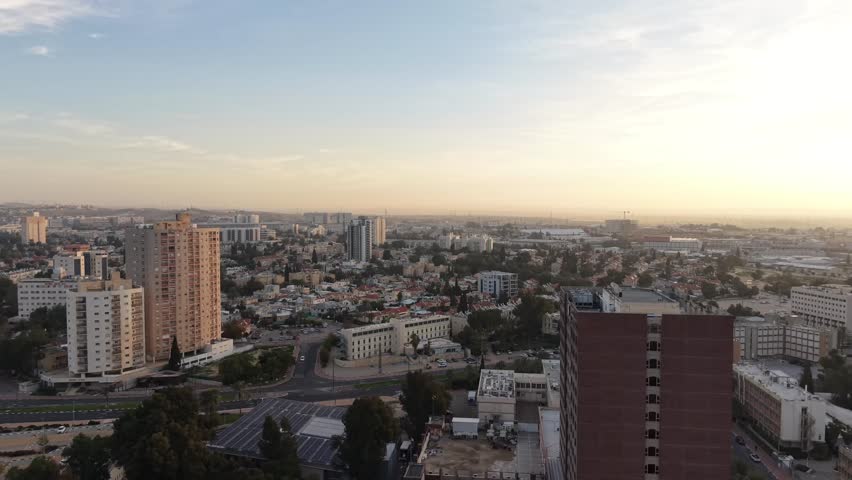 Aerial Sunrise Over Central Beersheba Skyline, Israe, Urban Cityscape at Dawn