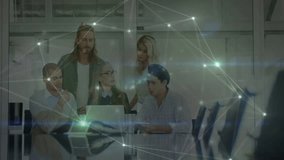 Business team typing and pointing on laptop while network overlay appearing to confirm insights. Collaboration, innovation, digital, analysis, brainstorming, teamwork, modern - Powered by Shutterstock - Get 15% off with code: PIKWIZARD15