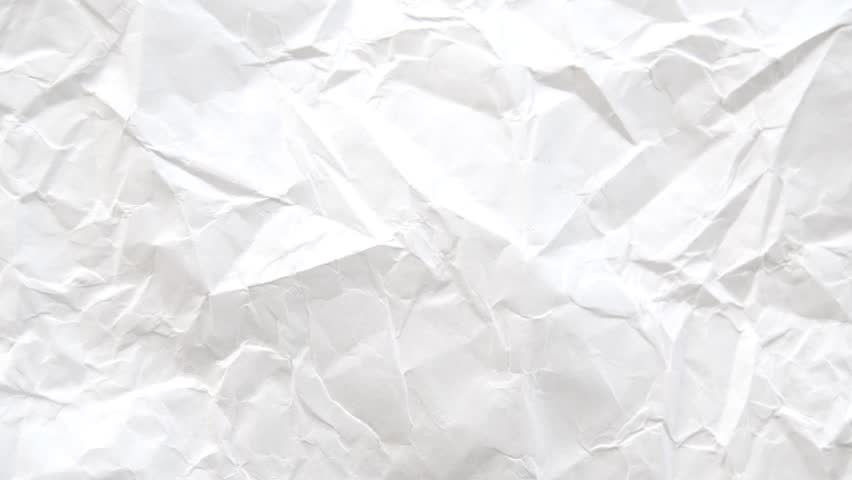 Creative background with scattered overlay of crumpled papers.