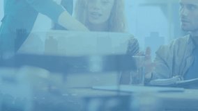 Animation of cityscape over diverse business people at office. Global business, computing and digital interface concept digitally generated video. - Powered by Shutterstock - Get 15% off with code: PIKWIZARD15