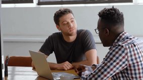 Animation of network of connections with icons over diverse businessmen discussing work. Global business and digital interface concept, digitally generated video. - Powered by Shutterstock - Get 15% off with code: PIKWIZARD15