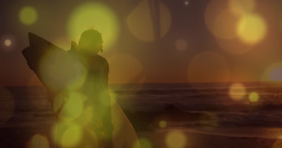 Animation of light spots over caucasian man with surfboard. Spending time together and digital interface concept digitally generated video.