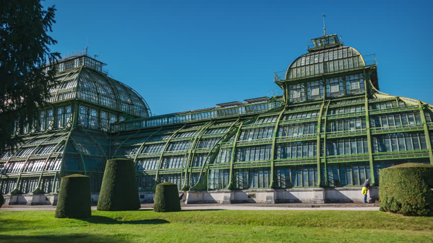 Palm House (Groses Palmenhaus) in park of Schoenbrunn hyper lapse, Vienna, Austria