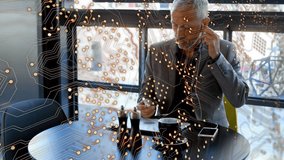 Animation of microprocessor connections over caucasian senior businessman talking on smartphone. Global networking and business technology concept - Powered by Shutterstock - Get 15% off with code: PIKWIZARD15