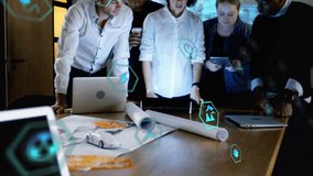 Computer application icons connecting with lines over multiracial coworkers discussing in board room. Animation, digital composite, teamwork, business, communication and technology concept. - Powered by Shutterstock - Get 15% off with code: PIKWIZARD15