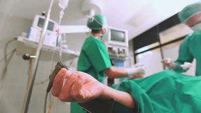 Animation of network of purple particles over diverse group of surgeons operating on patient. Medical services, data and communication network concept digitally generated video. - Powered by Shutterstock - Get 15% off with code: PIKWIZARD15