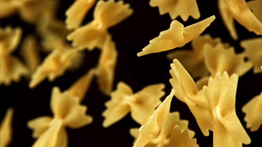 Super slow motion flying dry farfalle pasta . Filmed on a high-speed camera at 1000 fps. High quality FullHD footage