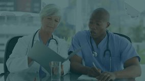 Animation of padlock icon over diverse doctors using tablet in hospital. Global cyber security, medicine and healthcare services concept digitally generated video. - Powered by Shutterstock - Get 15% off with code: PIKWIZARD15