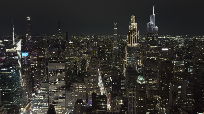 New York City skyline illuminated skyscrapers at night wide 