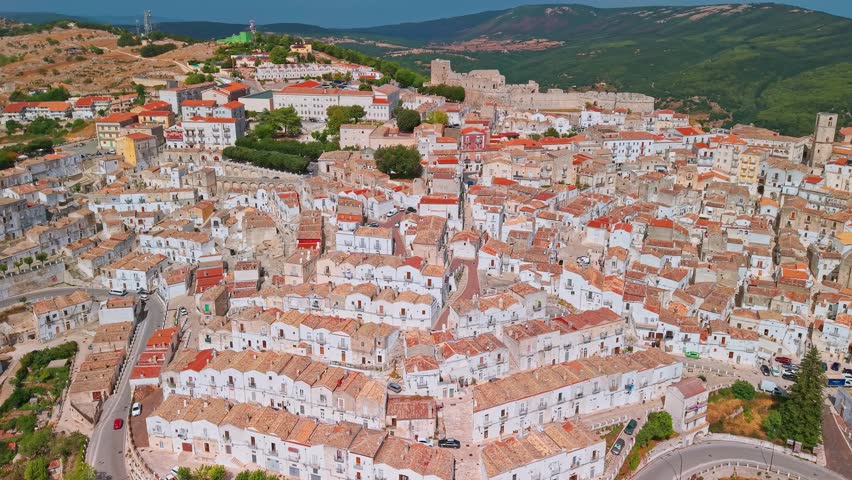 Aerial view of Monte Sant Angelo town on the Gargano peninsula in Italy. Famous for Sanctuary of San Michele Arcangelo and a medieval hilltop fortress overlooking the Adriatic Sea