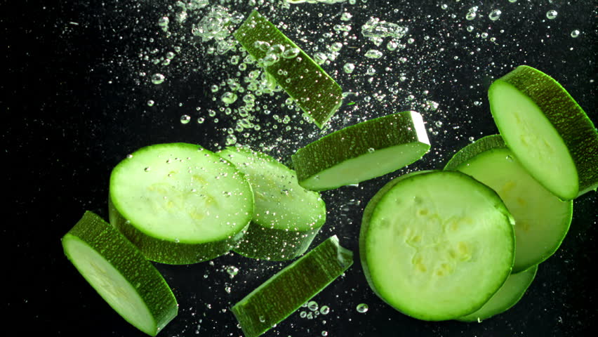 Super slow motion zucchini slices . Filmed on a high-speed camera at 1000 fps. High quality FullHD footage