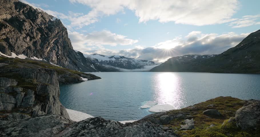 Sunset against the backdrop of the Norwegian mountains. Beautiful Nature Norway natural landscape.