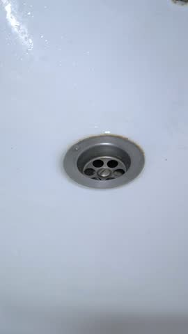 Water flowing down a sink drain