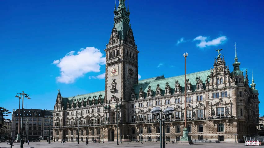Panorama showing a building of the Hamburg City Hall timelapse, the seat of the government of Hamburg, located in the Altstadt quarter in the city center. View from the main square under a cloudy skyHamburg City Hall or Hamburger Rathaus is the seat of local government of Hamburg, Germanyalster, architecture, attraction, building, central, ,  hall, destination, downtown, economy, europe, european, famous, german, germany, government, governmental, hall, hamburg, hanse, hanseatic, historic, historical, history, house, kleine, landmark, neo renaissance, old, panorama, parliament, place, port, rathaus, seat, senate, sightseeing, sky, square, station, summer, tourism, tourist, tower, town, travel, urban, 