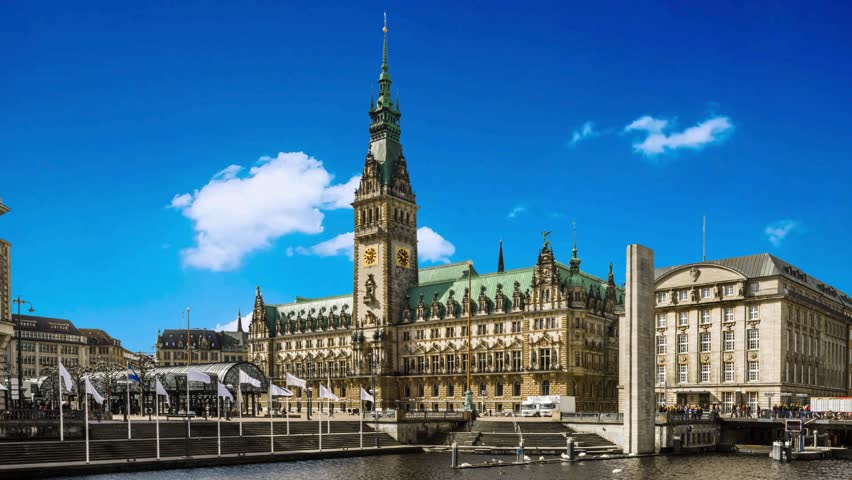 Panorama showing a building of the Hamburg City Hall timelapse, the seat of the government of Hamburg, located in the Altstadt quarter in the city center. View from the main square under a cloudy skyHamburg City Hall or Hamburger Rathaus is the seat of local government of Hamburg, Germanyalster, architecture, attraction, building, central, ,  hall, destination, downtown, economy, europe, european, famous, german, germany, government, governmental, hall, hamburg, hanse, hanseatic, historic, historical, history, house, kleine, landmark, neo renaissance, old, panorama, parliament, place, port, rathaus, seat, senate, sightseeing, sky, square, station, summer, tourism, tourist, tower, town, travel, urban, 