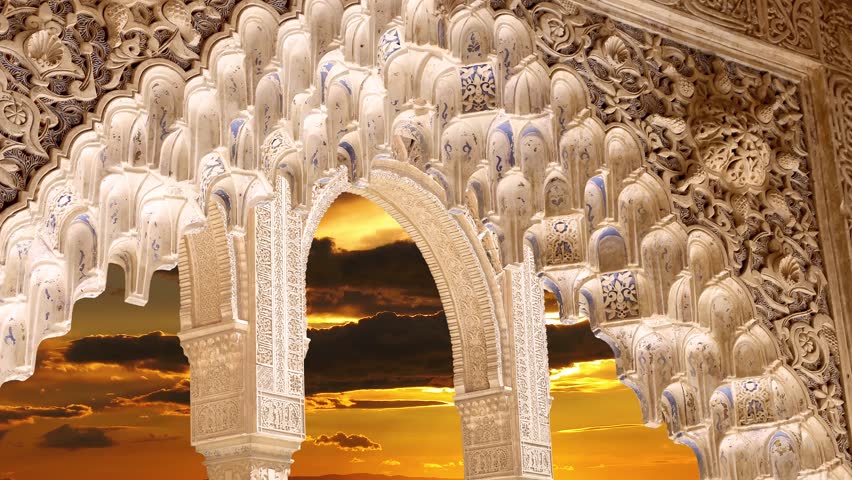 Arches in Islamic (Moorish)  style (against the sunset) in Alhambra, Granada, Spain. 4K, time lapse, with zoom 