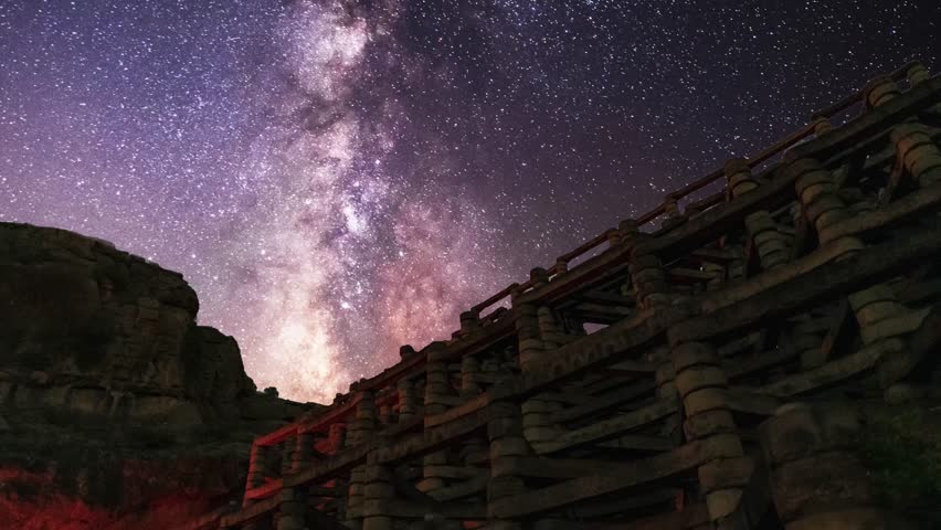 Beautiful night landscape, old bulding  under bright milky way galaxy at starry night. Time lapse