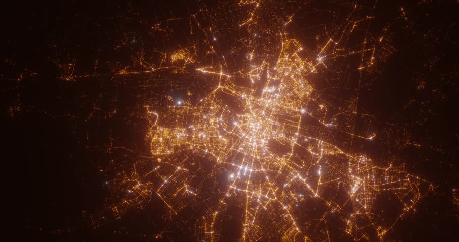 Poznan (Poland) top view at night. Aerial view on modern city with lights. Camera is flying above the city, moving backward. Vertical video. The north is on the left side