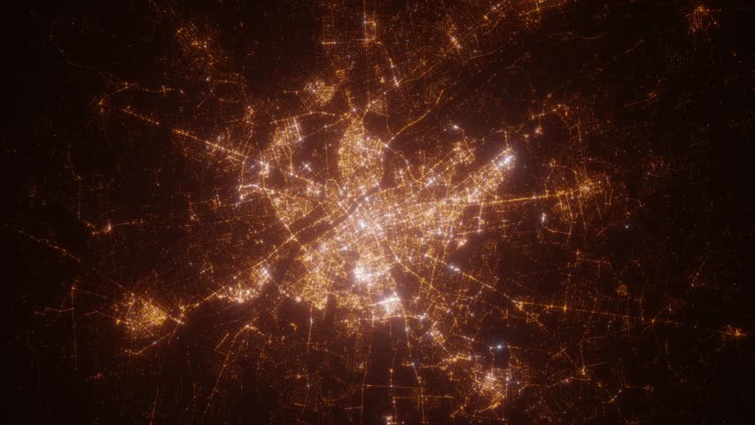 Warsaw (Poland) top view at night. View on modern city from satellite. Camera is zooming in, rotating counterclockwise. Vertical video. The north is on the left side