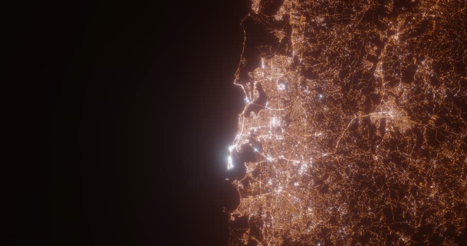 San Juan (Puerto Rico) top view at night. Aerial view on modern city with lights. Camera is flying above the city, moving backward. Vertical video. The north is on the left side