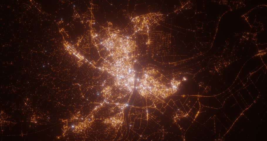 Bratislava (Slovakia) aerial view at night. Top view on modern city with street lights. Camera is zooming out, rotating clockwise. Vertical video. The north is on the left side