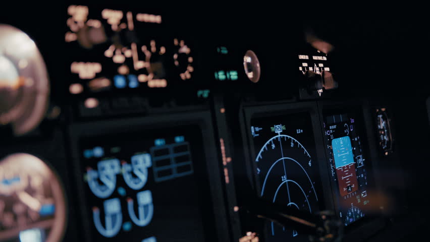 Modern flight deck interior with active cockpit displays providing pilots with real time aircraft performance information