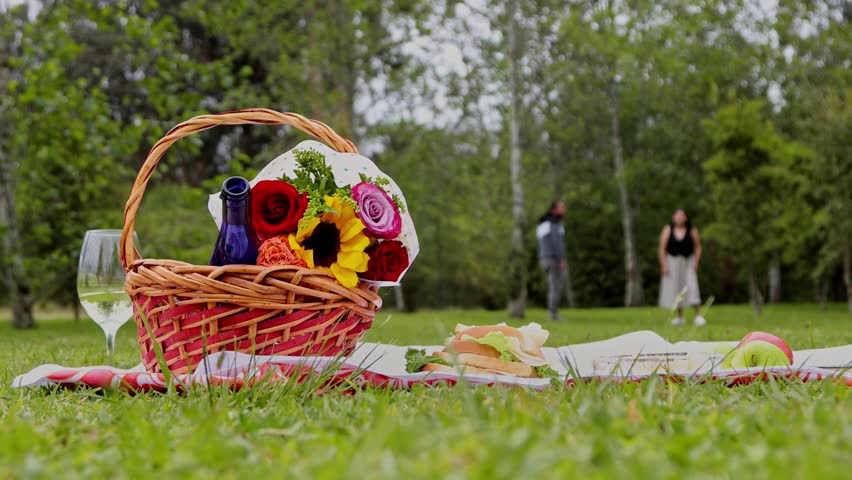 Happy couple playing tag outdoors, boyfriend running after his girlfriend during a playful moment full of laughter, movement, and romantic connection in a natural setting.