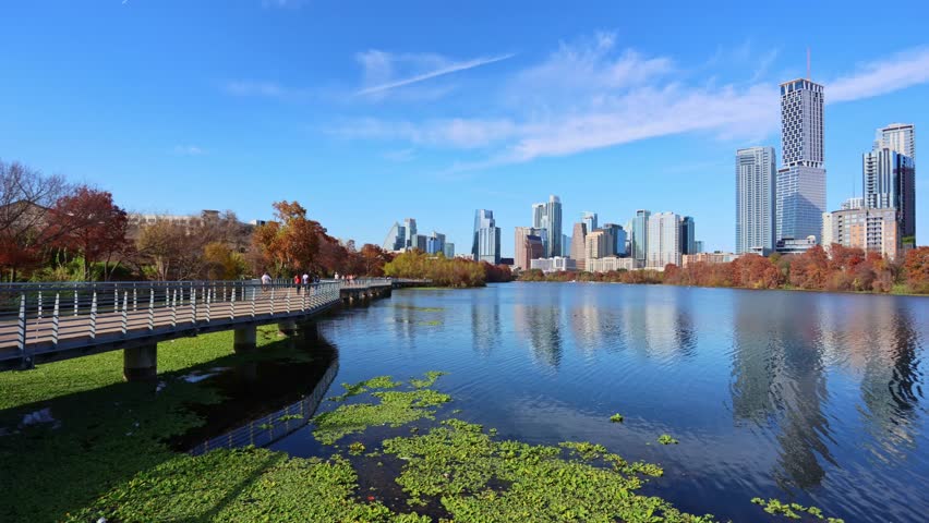Austin downtown modern technology office skyline with business buildings reflecting on the river during sunny day, showcasing innovation, urban growth, and the expanding tech hub of Texas, USA