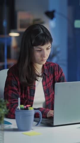 Angry frustrated young nervous caucasian woman office manager overworking staying late in coworking space throwing things around room.