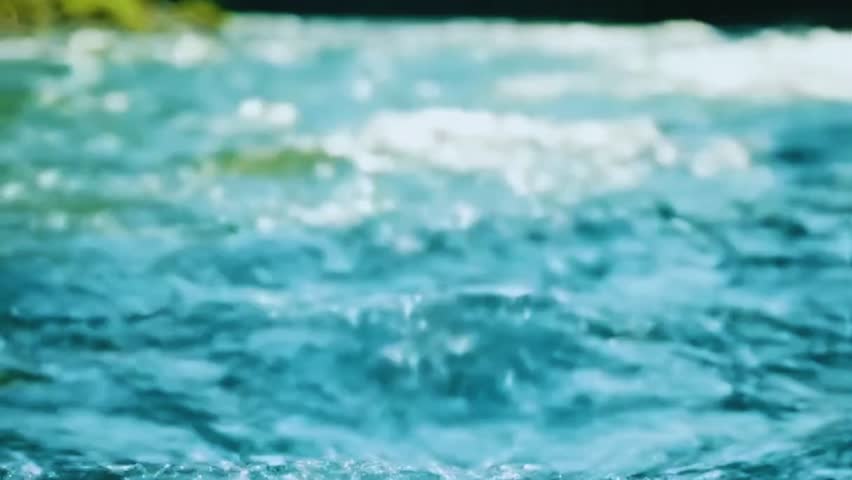 Abstract close-up video of flowing blue water with natural waves and motion. Clean, fresh and dynamic water texture background. Perfect for nature, environment, purity, hydration, calm, relaxation, sustainability, and abstract motion concepts. No people, no logos, commercial use safe.