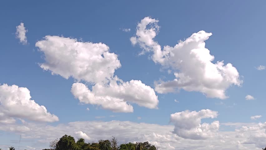 The beautiful blue sky and the clouds provide a natural backdrop.