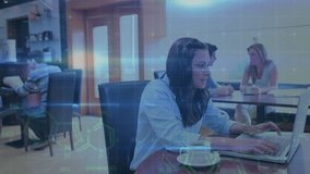 Animation of data processing over caucasian woman using laptop in cafe. Global communication, business, research and digital interface concept digitally generated video. - Powered by Shutterstock - Get 15% off with code: PIKWIZARD15