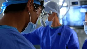 Animation of molecules over diverse surgeons operating. global medicine, science and data processing concept digitally generated video. - Powered by Shutterstock - Get 15% off with code: PIKWIZARD15