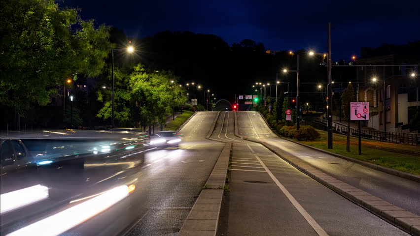 Night time lapse clip of a busy road in Le Havre in northern France