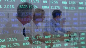 Animation of financial data processing over business people. Global business finance connections and digital interface concept digitally generated video. - Powered by Shutterstock - Get 15% off with code: PIKWIZARD15