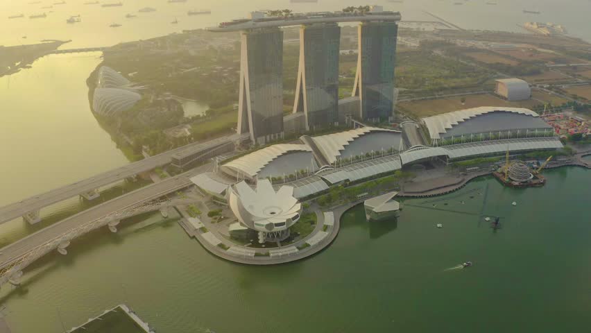 Drone Aerial view 4k Footage of the Marina Bay Sands in Singapore City Skyline. Sunrise. Singapore City