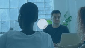 Animation of connected icons with lines on multiracial coworkers sharing ideas in meeting in office. Digital composite, multiple exposure, teamwork, communication, abstract and technology concept. - Powered by Shutterstock - Get 15% off with code: PIKWIZARD15