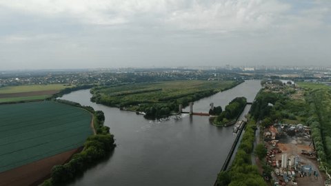 Drone Ascending near Winding River Landscape